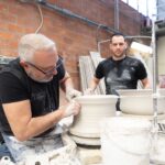 Master artisan demonstrating traditional technique during the pottery wheel workshop in Tuscany