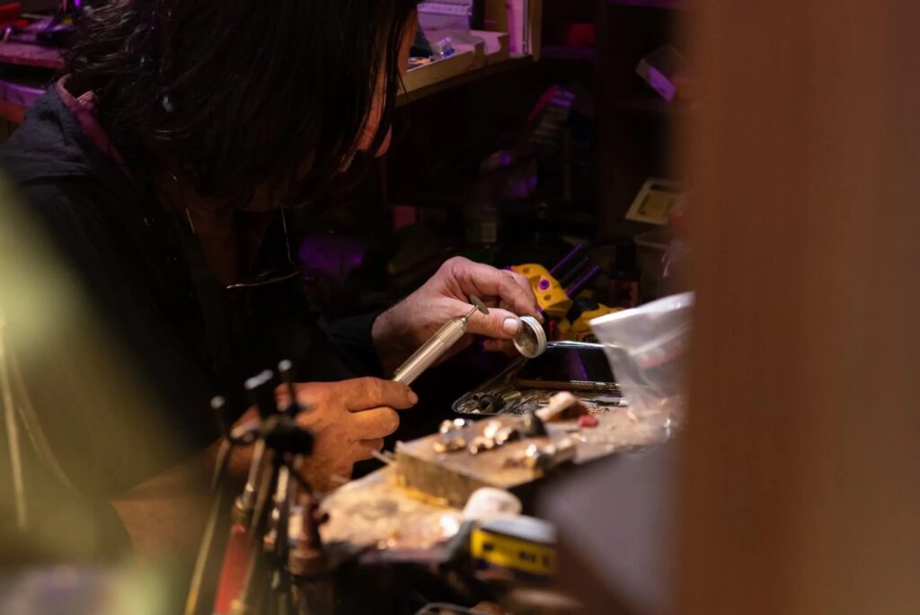 Master goldsmith shaping jewelry during the Goldsmith Workshop in Florence