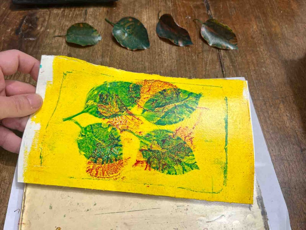 Finished yellow and green leaf monoprint from the art workshop for kids Florence at Fatacadabra