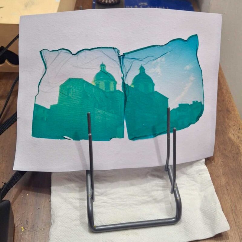 Finished Polaroid emulsion lift transfer of Florence cathedral drying on a stand at Fatacadabra photography workshop