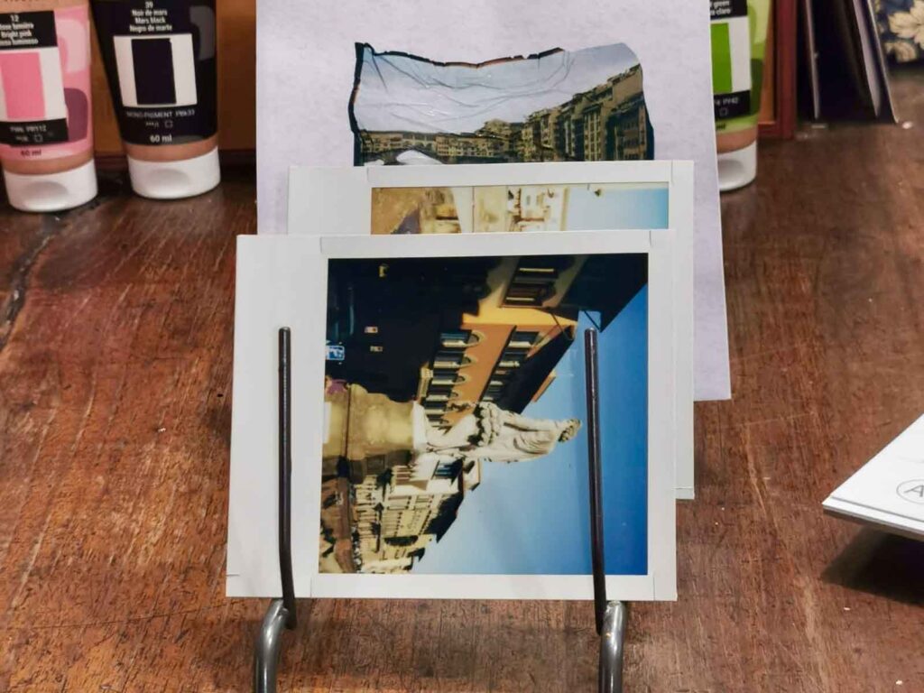 Polaroid photos and emulsion lift transfers of Florence scenes displayed at Fatacadabra photography experience