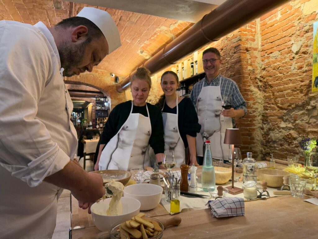 Florence cooking class with chef demonstrating tiramisù in a private hands-on workshop