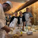 Florence cooking class with chef demonstrating tiramisù in a private hands-on workshop