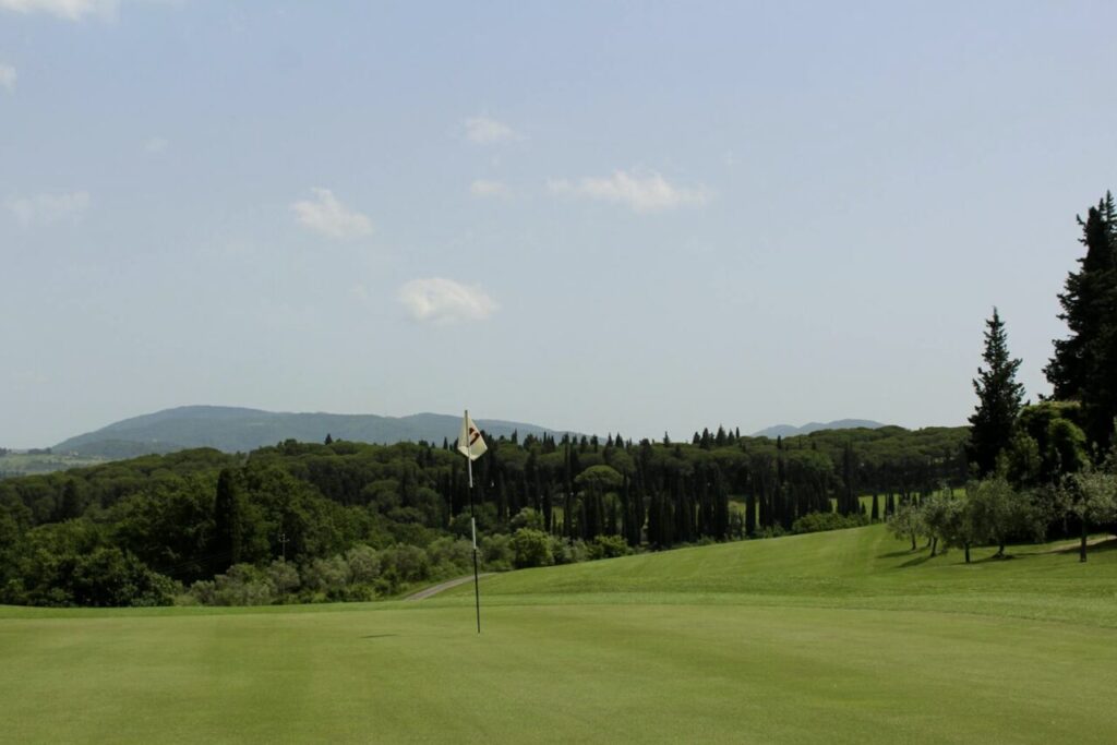 Golf green with flag on a Chianti course.