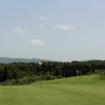 Golf green with flag on a Chianti course.