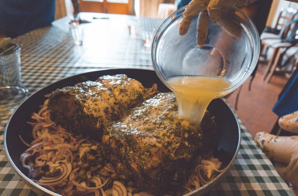 Guests preparing a traditional Tuscan second course during the Chianti cooking class