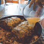 Guests preparing a traditional Tuscan second course during the Chianti cooking class