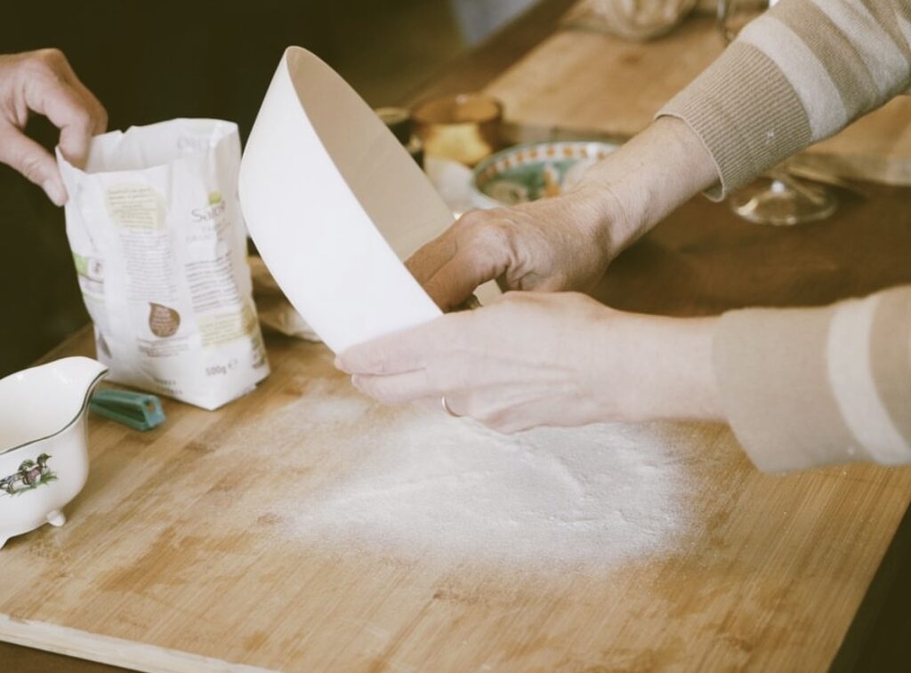 Guests preparing fresh pasta dough by hand during the Chianti pasta making class