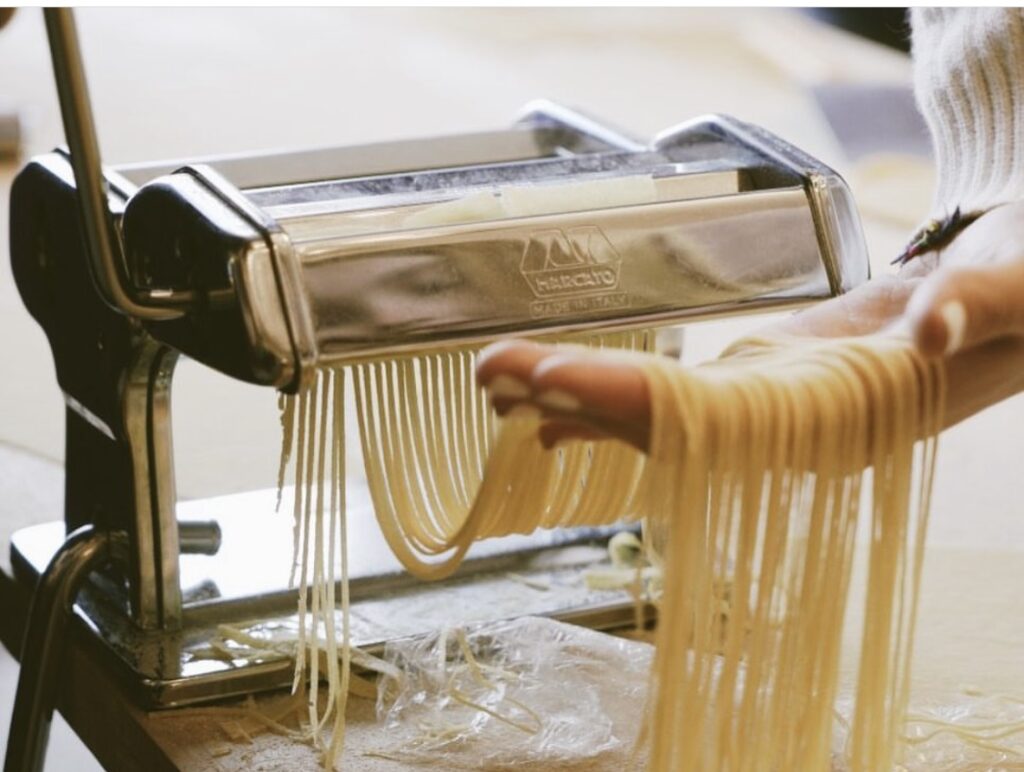Fresh tagliatelle cut with a pasta machine during the Chianti pasta making class