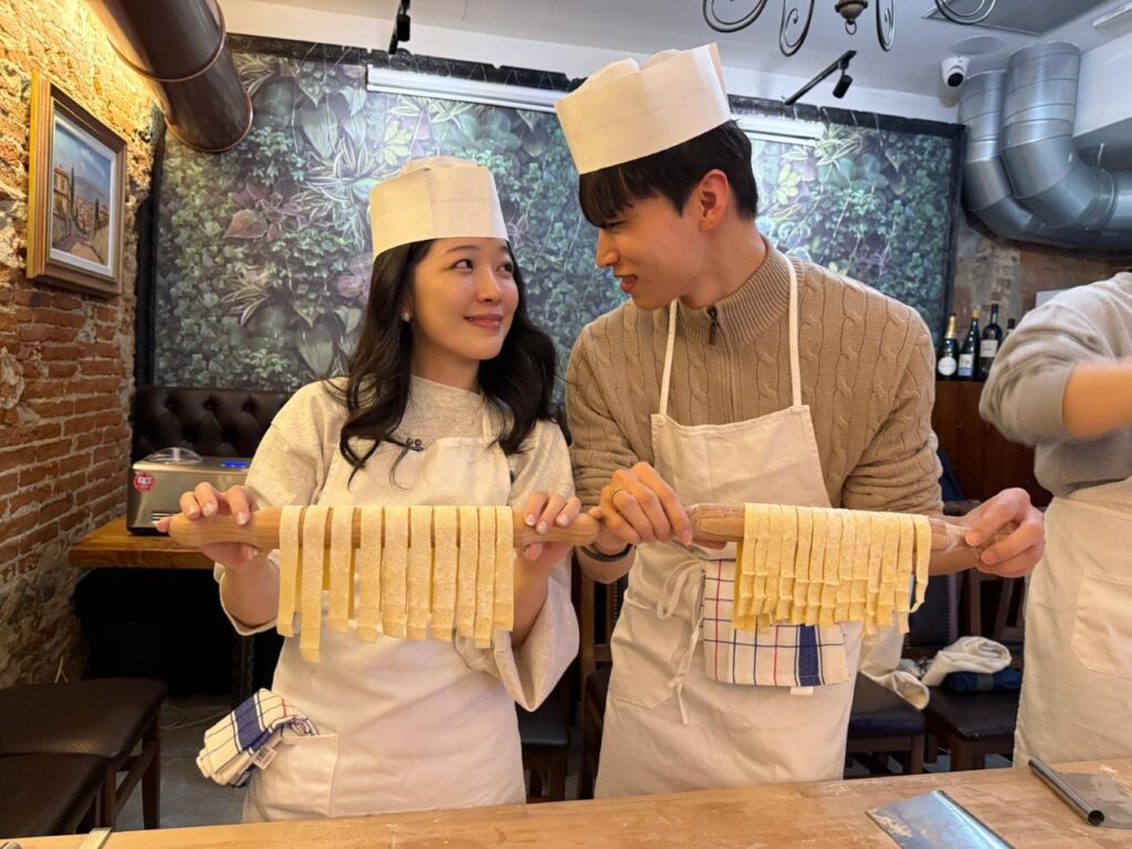 Pasta class Florence experience with a couple making fresh handmade pasta together