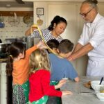 Family group with children during a private tuscan cooking in florence with market shopping