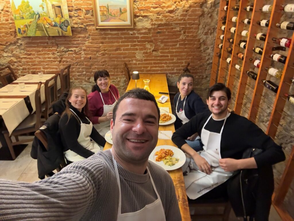 Family cooking class Florence guests enjoying the meal they prepared together on site