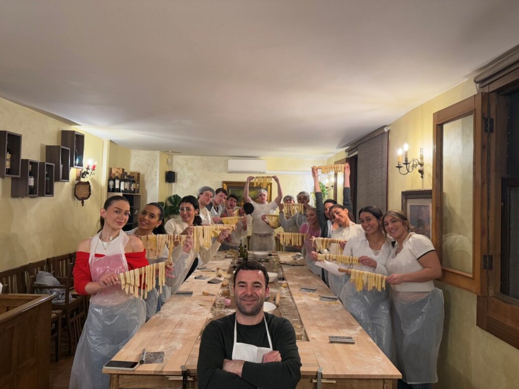 Private cooking class in Florence for families and groups making fresh pasta together