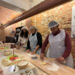 Students rolling dough during pasta class