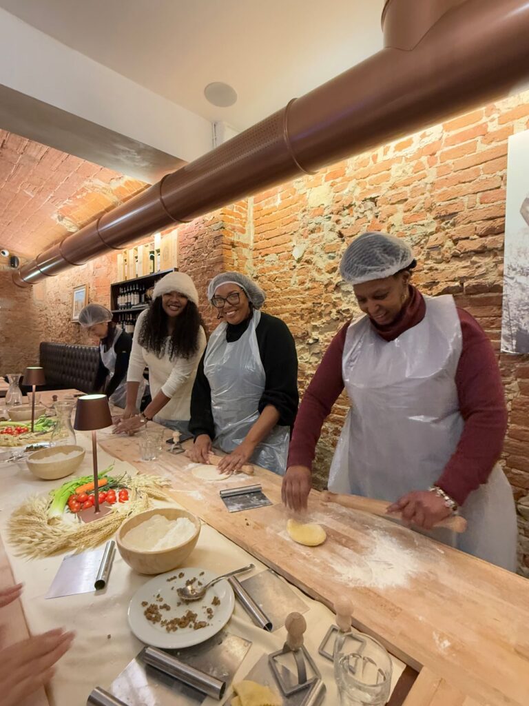 Students rolling dough during pasta class