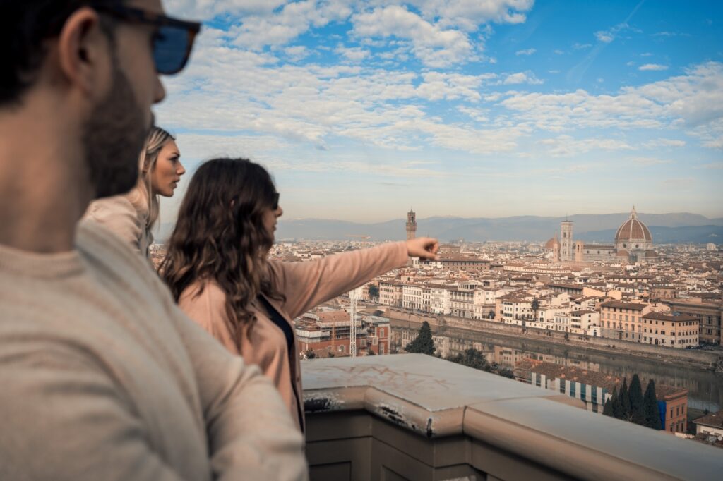 Guests admiring Florence skyline from Piazzale Michelangelo during a Florence e-bike tour