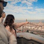 Guests admiring Florence skyline from Piazzale Michelangelo during a Florence e-bike tour