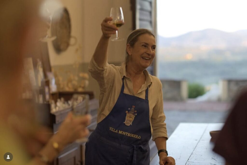 Host welcoming guests at a historic family villa during a cooking class near Florence in the Tuscan countryside