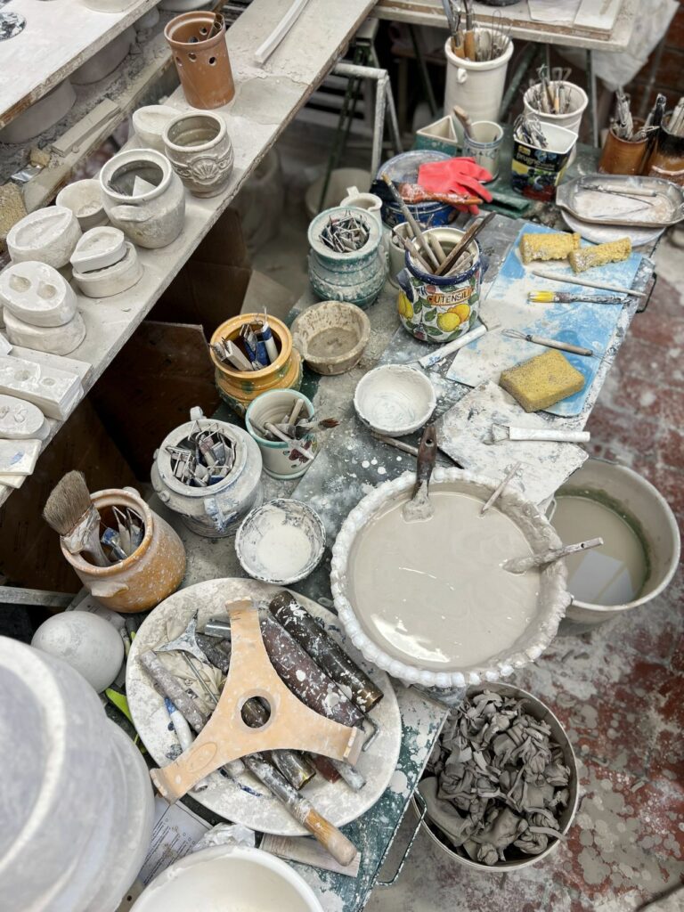 Pottery tools and clay station in a family-friendly ceramics activity in Tuscany