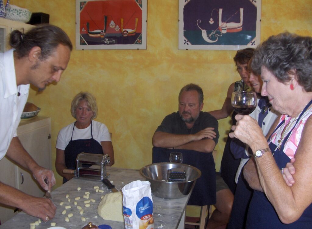 chef demonstrating handmade gnocchi preparation during a cooking class