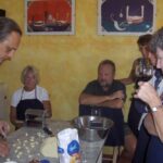 chef demonstrating handmade gnocchi preparation during a cooking class