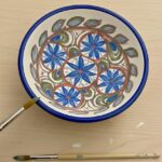 Finished Maiolica ceramic bowl with blue floral pattern painted in a ceramic painting in Florence