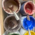 Traditional Maiolica ceramic paint pots used in a ceramic painting in Florence