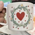 Hand-painted ceramic mug with heart and wreath design made in a ceramic painting in Florence