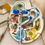 Paint palette and brushes used in a ceramic painting in Florence