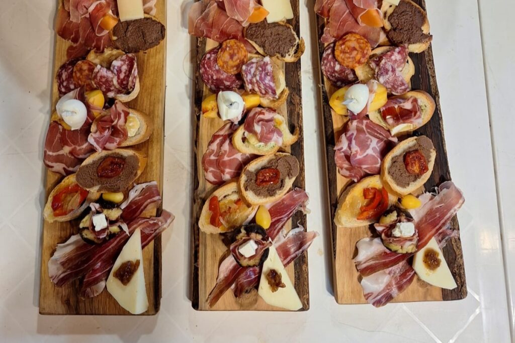 assorted Tuscan appetizers with cheese and cured meats for wine tasting