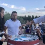 pouring red wine during Chianti wine tasting on countryside terrace