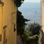 Florence Duomo seen through a narrow alley in Fiesole on the e-bike tour from Florence