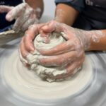 Close-up of wheel throwing during the private pottery workshop in Tuscany