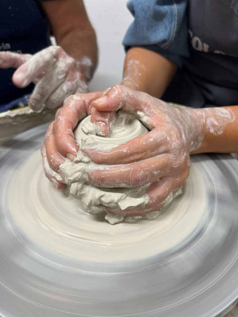 Close-up of wheel throwing during the private pottery workshop in Tuscany