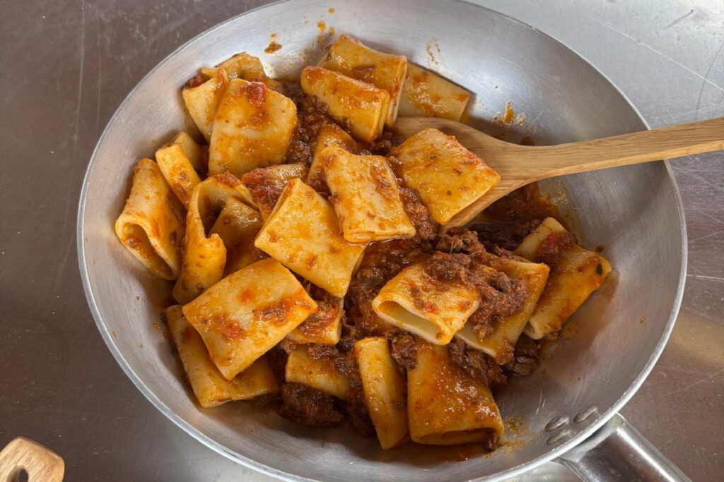 Tuscan pasta with meat ragù served at the castle estate lunch stop on the Chianti horseback tour from Florence
