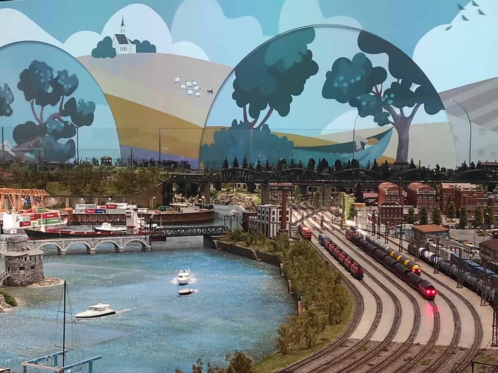 Panoramic harbour scene with model trains and boats at HZERO Museum Florence kids activity