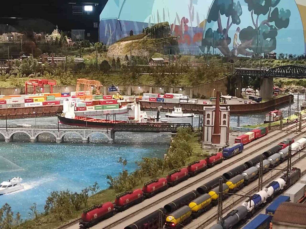 Miniature port with freight trains and cargo ships at HZERO Museum family tour Florence